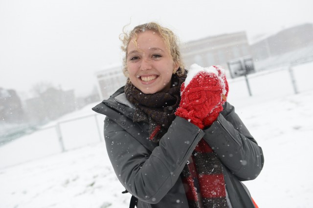 Rebecca Brand '16 makes a snowball. 