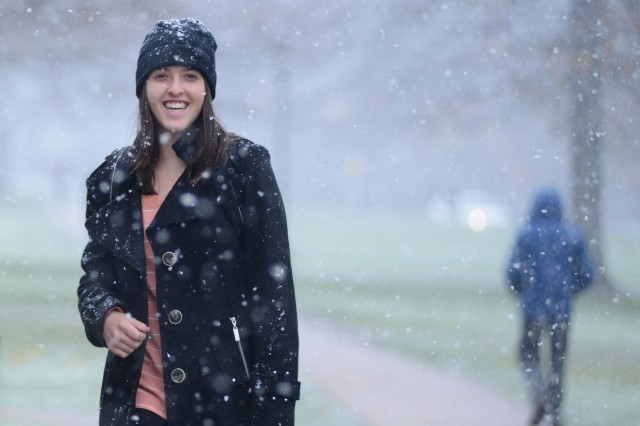 Jessica Seidman '16 enjoys the light snowfall Nov. 27 as she crosses College Row. 