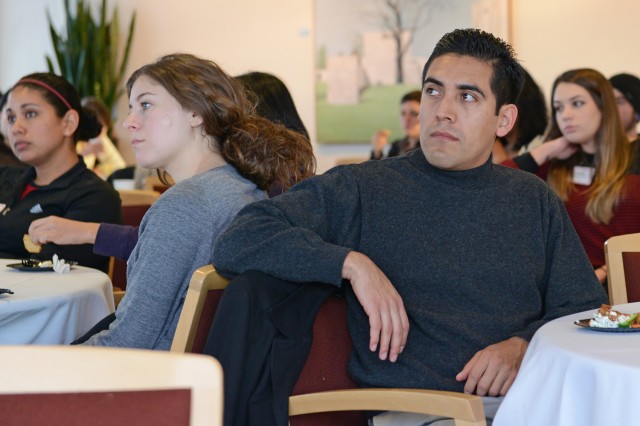 At left, Raquel Martinez, a graduate student in astronomy; Madeleine Manheim, a BA/MA graduate student in astronomy; and Christopher Ramos Flores, a graduate student in music, listen to President Roth. 