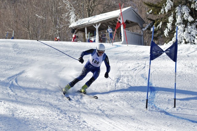 Chris Delaney ’14 rounds the third gate of the Giant Slalom race at the Middlebury College Snow Bowl.  