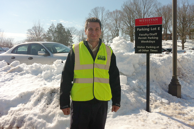 C-CERT members also assisted Wesleyan staff and faculty on Feb. 13 by directing them to open parking spaces. With a parking ban in effect, employees were not allowed to park on city streets. Wesleyan's Transportation Services offered shuttle rides for those parking away from campus. Pictured is Mario Velasquez, facilities manager at Physical Plant-Facilities, who manned parking lot E near Beckham Hall.  