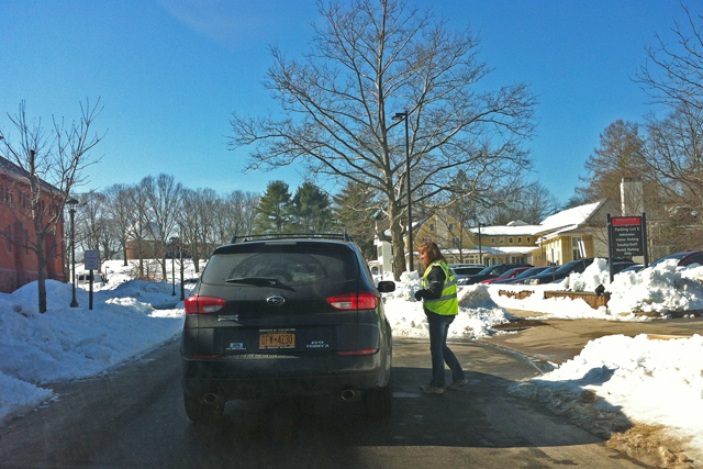 C-CERT member Debra Holman, facilities manager in Physical Plant-facilities, helps a campus visitor find parking near the Office of Admission. 