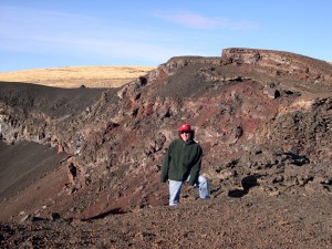 Christopher Kincaid ’83 stands in a lava field in Oregon.