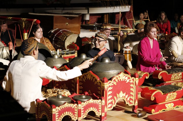 A gamelan (orchestra), using various combinations of instruments, is traditionally and essentially accompaniment to puppet shows, dances, feasts, and ceremonies in Java. Most of the instruments are bronze: tuned gongs, suspended vertically or horizontally; and instruments with tuned keys, suspended over tubular resonators or a resonant cavity in the base of the instrument