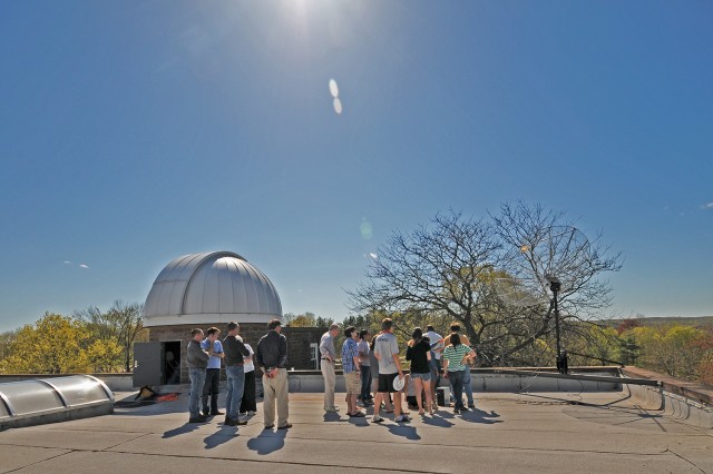 Astronomy students and faculty celebrated the new small radio telescope (SRT) on May 1 during a ribbon-cutting ceremony. The SRT has a motorized arm that can position the dish to face any part of the sky. Quasars, pulsars, and the afterglow of the Big Bang have all been discoveries of radio astronomy.