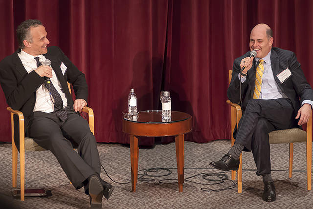 At left, Wesleyan President Michael Roth and Matt Weiner '87 speak at the recent fundraising event in NYC. 