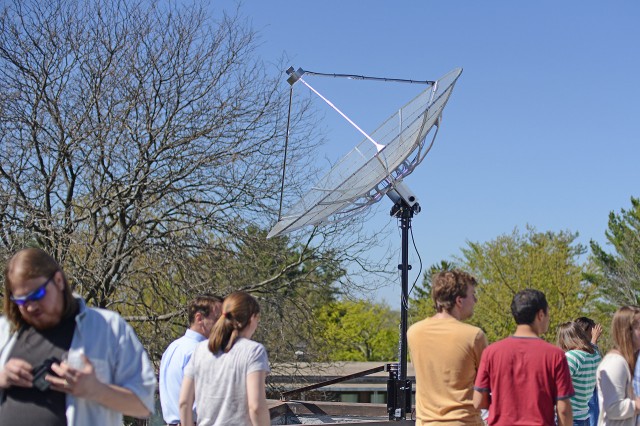 Astronomy students and faculty celebrated the new small radio telescope (SRT) on May 1 during a ribbon-cutting ceremony. The SRT has a motorized arm that can position the dish to face any part of the sky.  Quasars, pulsars, and the afterglow of the Big Bang have all been discoveries of radio astronomy.  