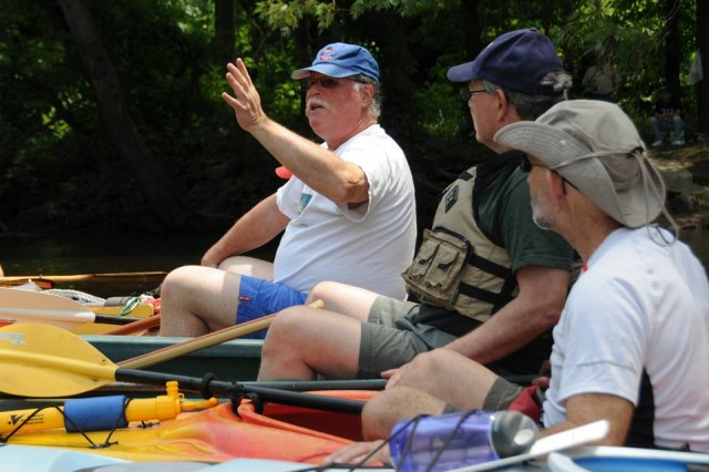 On June 22, Barry Chernoff, the Robert Schumann Professor of Environmental Studies, professor of biology, spoke to more than 60 paddlers about river biodiversity during the annual Jonah Center Canoe and Kayak Paddle. Paddlers left from Harbor Park in Middletown and explored the Connecticut River and Wilcox Island, the lower Mattabesset and Coginchaug Rivers, as well as the "Floating Meadows" where those two rivers converge. Pictured here, Chernoff is speaking about fish who live in a 90-foot hole located in the Mattabesset River. 