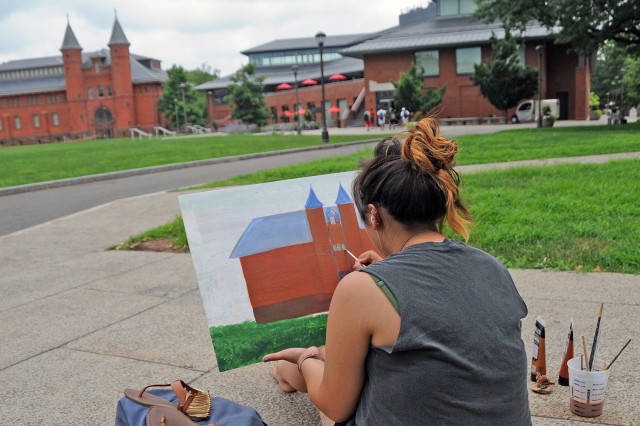 Paige Schmitt, 17, a rising senior at Watkinson School in Hartford, Conn. painted the Fayerweather building. Schmitt also is taking CCY classes on steel pan drums and Japanese Sumi-e painting this summer. 