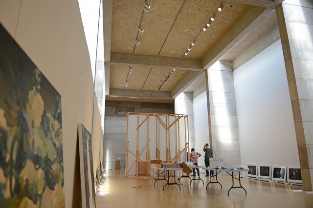 The Center for the Arts is hosting "The Alumni Show II" exhibit Sept. 6-Dec. 8 in the Ezra and Cecile Zilkha Gallery. On Aug. 14, CFA staff worked to hang art featured in the show.