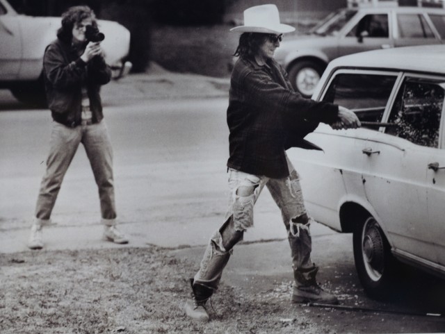 In this 1986 photograph, director/producer/writer Joss Whedon '87, at left, makes a student film with classmate Richter Hartig '87. This photograph, taken by Brooks Kraft '87, is on display in the "Joss Whedon: From Buffy to the Bard" exhibit inside the Nicita Gallery through December.