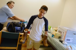 Hawaiian resident Rick Manayan '17 bought his first pair of winter boots in anticipation of a snowy New England winter. He moved into Clark Hall on Aug. 28 with help from his parents, Rick and Mae. 