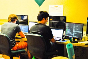 Students work on their programs during the Wesleyan Hackathon. (Photo by Shannon Welch '14)