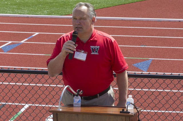 Mike Whalen, the Frank V. Sica Director of Athletics and Chair of Physical Education, spoke at the Andersen Track and new turf field re-dedication ceremony Sept. 21. 