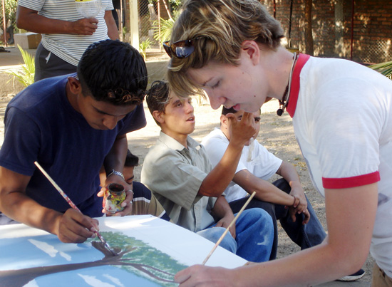 At right, Jessica French Smith '09, paints a mural with students from Nagarote, Nicaragua. French Smith received a Projects for Peace grant, which will allow her and fellow Wesleyan students to return to the city this summer to build a community center.
