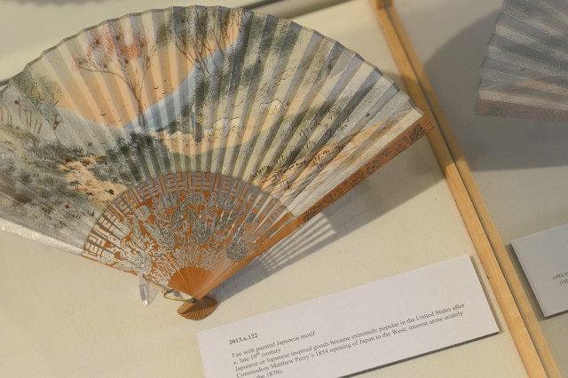 The exhibit features this fan with a painted Japanese motif from the late 19th century.  Japanese or Japanese inspired goods became extremely popular in the United States after Commodore Matthew Perry’s 1854 opening of Japan to the West; interest arose acutely during the 1870s.