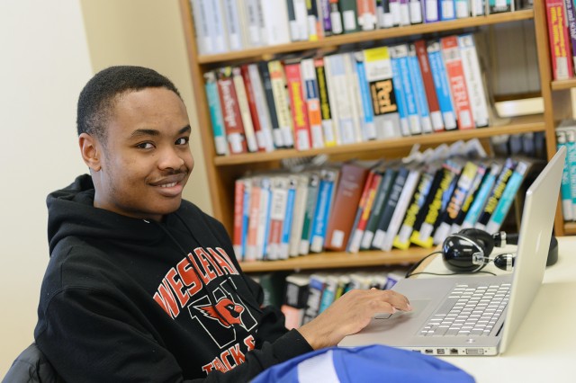 College of Social Studies major Chando Mapoma '16, pictured here in the Science Library, spent half his spring recess vacationing in Florida, but returned to campus early for spring training. "I have a lot of track practice, but since I'm a CSS major, I'm always trying to catch up and get ahead."