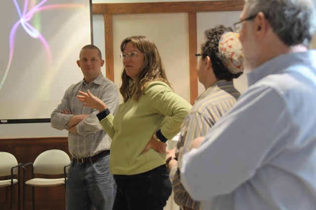 This workshop emphasized ways students can use multiple knowledge sets to approach a topic and draw on their personal experiences, and ways faculty can diminish the hierarchy between student and teacher. Pictured from left is Steve Stemler, associate professor of psychology; Elizabeth McAlister, professor of religion, professor of African American Studies, professor of American studies;  University Jewish Chaplain David Leipziger Teva, director of religious and spiritual life; and Bill Herbst, the John Monroe Van Vleck Professor of Astronomy, director of graduate studies. (Photos by Hannah Norman '16)