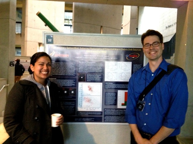 Raquel Martiniz MA '13 poses with her research poster and conference organizer John Debes. Raquel is currently working in NASA's Goddard Spaceflight Center and has been accepted to the Ph.D. program at the University of Texas where she will begin studies in the fall. 