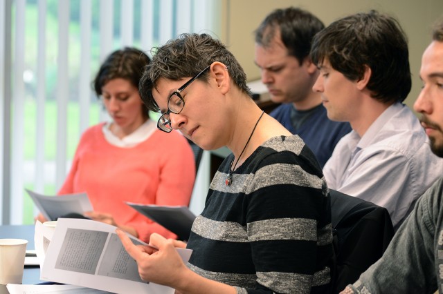 Faculty and students were provided with material relevant to the discussion to encourage participation. Pictured at center is Margot Weiss, associate professor of American studies and anthropology. Pictured in the background, from left, is Rachel Ellis Neyra, assistant professor of English; Joseph Fitzpatrick, visiting faculty in the College of Letters and English Department; Matthew Garrett, assistant professor of English, assistant professor of American studies; and Matt Chilton ’16.