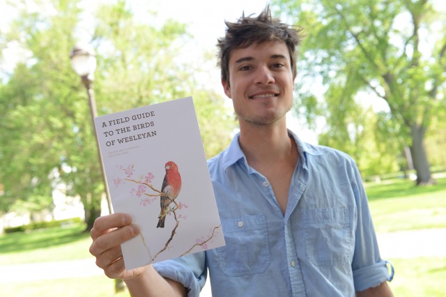 Oliver James '14 and his Connecticut bird guide.
