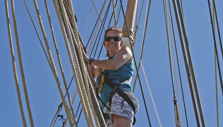 Helen Poulos climbs the rigging aboard the Charles W. Morgan, the last wooden whaling ship in existence.