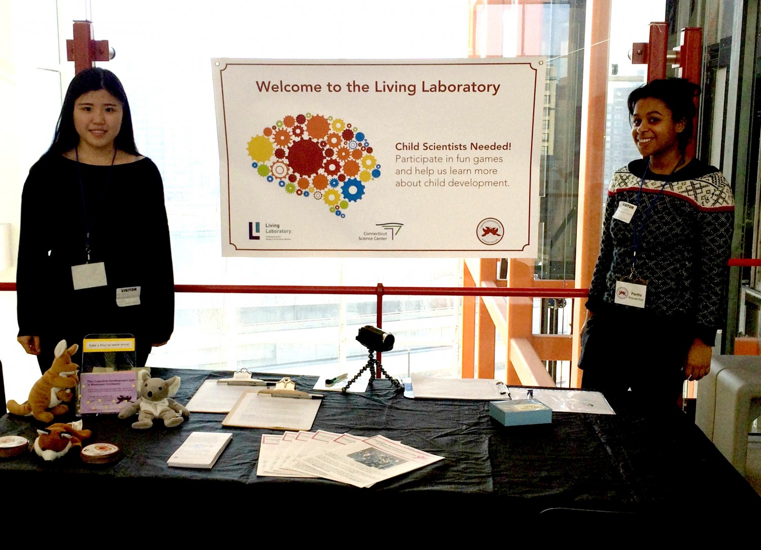 Cognitive Development Lab students Ziyue Li '16 and Portia Lundie '14 spoke with children and parents at the Connecticut Science Center last spring. 