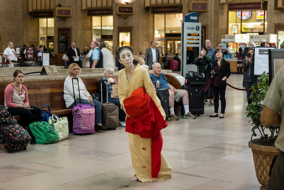 Eiko Otake, visiting instructor in dance, performed "Body in a Station" at the Amtrack's 30th Street Station in Philadelphia on Oct. 8. Otake will speak on "Nakedness" Nov. 5 and participate in an exhibition titled "A Body in Fukushima," at Wesleyan starting in February 2015. (Photo by William Johnston)