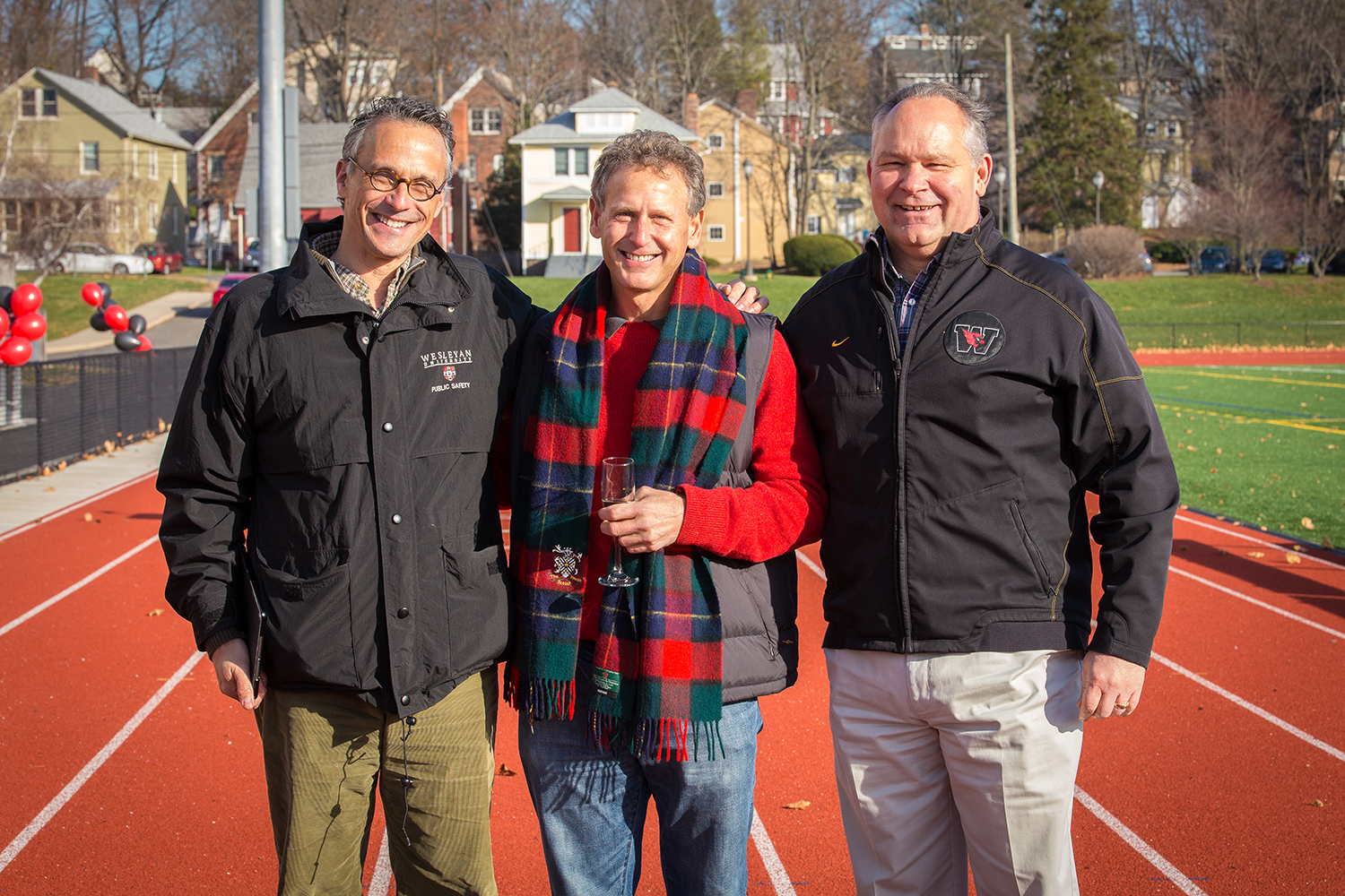 Jim Citrin P'12, P'14, in center, spoke on behalf of the Citrin family with President Michael Roth, at left, and Athletics Director Mike Whalen '83, at right. Jim Citrin's son, Teddy Citrin '12, was a high-scoring, four-year letterman in men's lacrosse, racking up 76 goals and 13 assists for 89 scoring points while helping the Cardinals post a record of 42-23 from 2009-12. His other son, Oliver Citrin '14, was a outstanding fan and men's lacrosse team photographer during his Wesleyan years.
