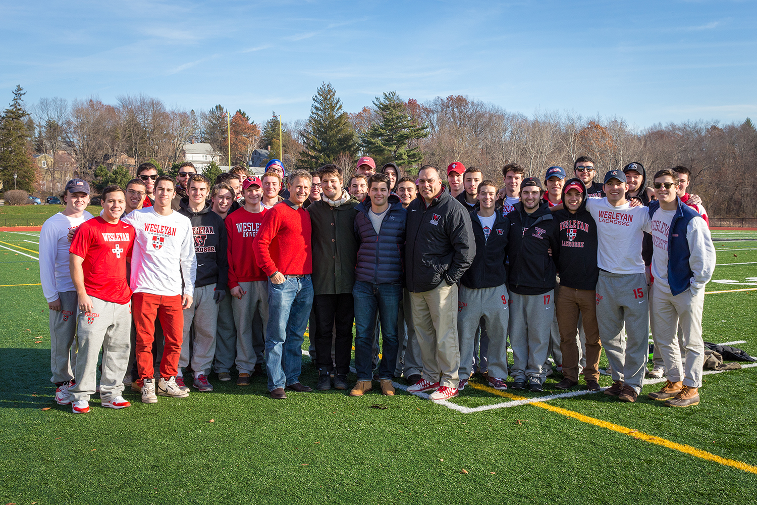 Jim, Teddy and Oliver Citrin joined Wesleyan head men's lacrosse coach John Raba and members of the 2015 team during the festivities.