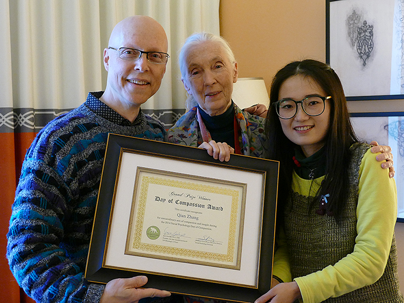Professor of Psychology Scott Plous and anthropologist Jane Goodall presented Qian Zhang of China with a Day of Compassion Award from the Jane Goodall Institute. Zhang was a student in Plous's Social Psychology MOOC last summer and received the honor for intervening when she heard a boy being beaten in a neighboring apartment. 