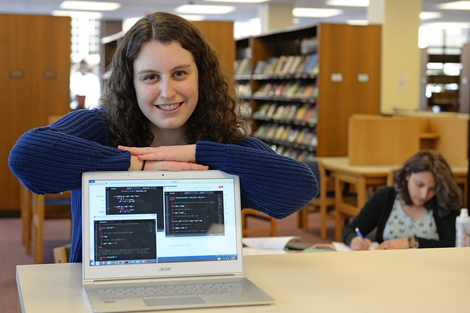 As a service-learning project, Alicia Gansley '15 helped create a web application for the Green Street Teaching and Learning Center. Gansley enjoys writing programs from the comfort of the Science Library. "This is where you're usually find me," she said.