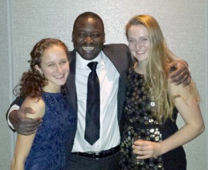 Ella Israeli '17, Kennedy Odede '12 and Kiley Kennedy '16 shared a group hug at the Ripple of Hope Gala. 