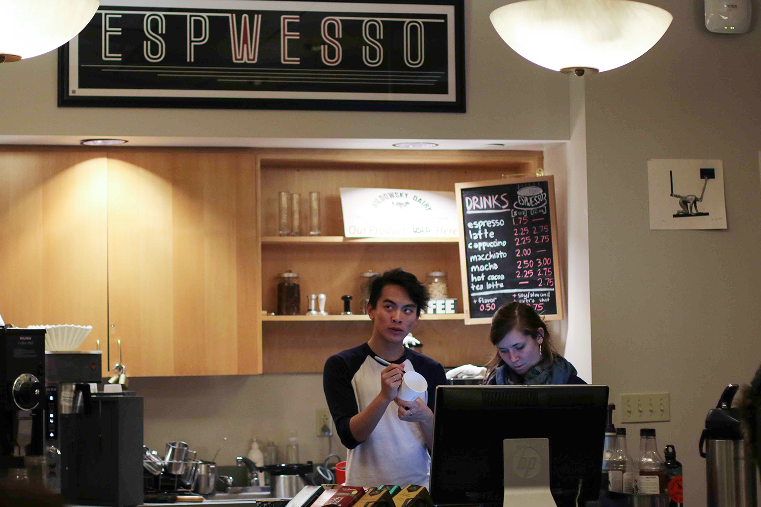 Emily Pfoutz '16 and Rick Manayan '17 busily make and distribute drinks at Espwesso, Wesleyan's student run cafe. 