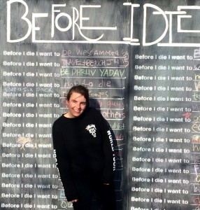 Laura McIntyre '17 with the "Before I Die" cube. (Contributed photo.)