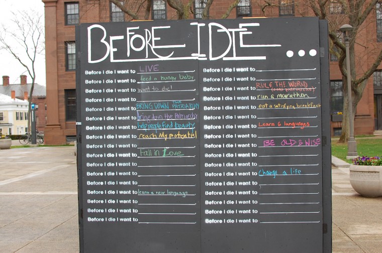 Laura McIntyre '17 brought the "Before I Die" public art project to Wesleyan the week of April 20. Members of the Wesleyan community were asked to fill in their fears, ambitions and thoughts on a blackboard cube installed outside Usdan University Center.