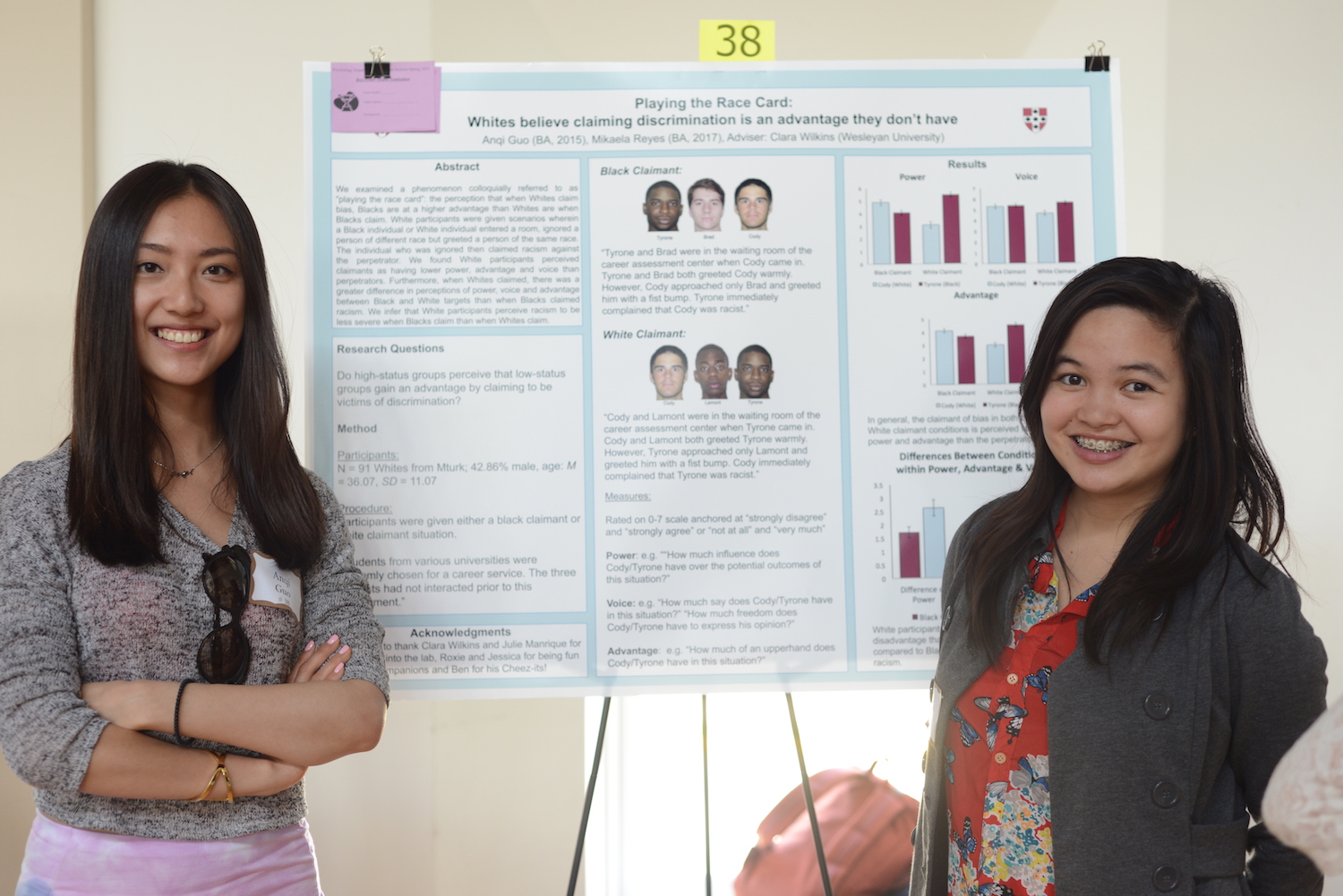 Anqi Guo '15 and Mikaela Reyes '17 with their research on "Playing the Race Card."