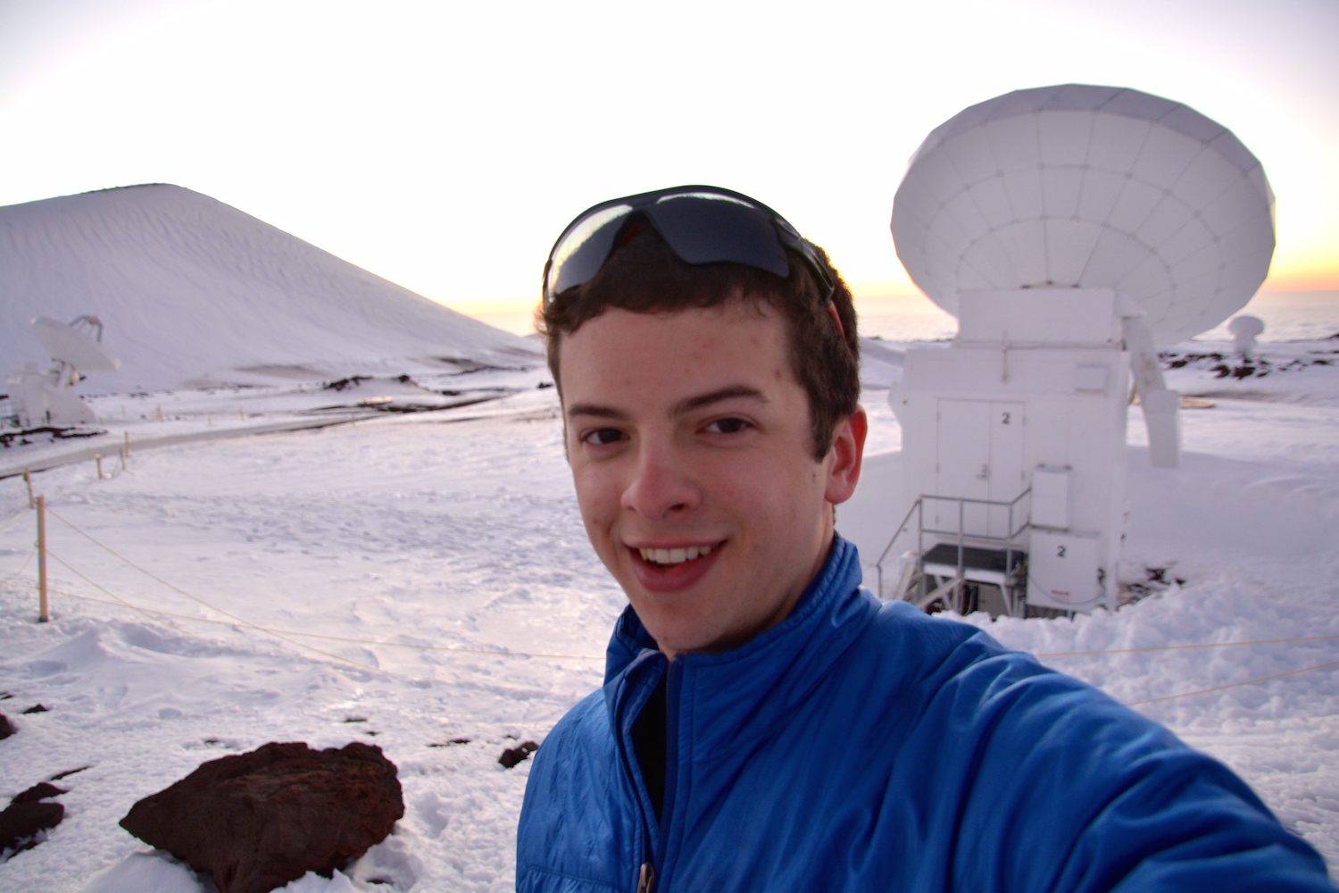 Sam Factor, a graduate student in astronomy, at the Submillimeter Array, located on Mauna Kea in Hawai'i in March 2015.