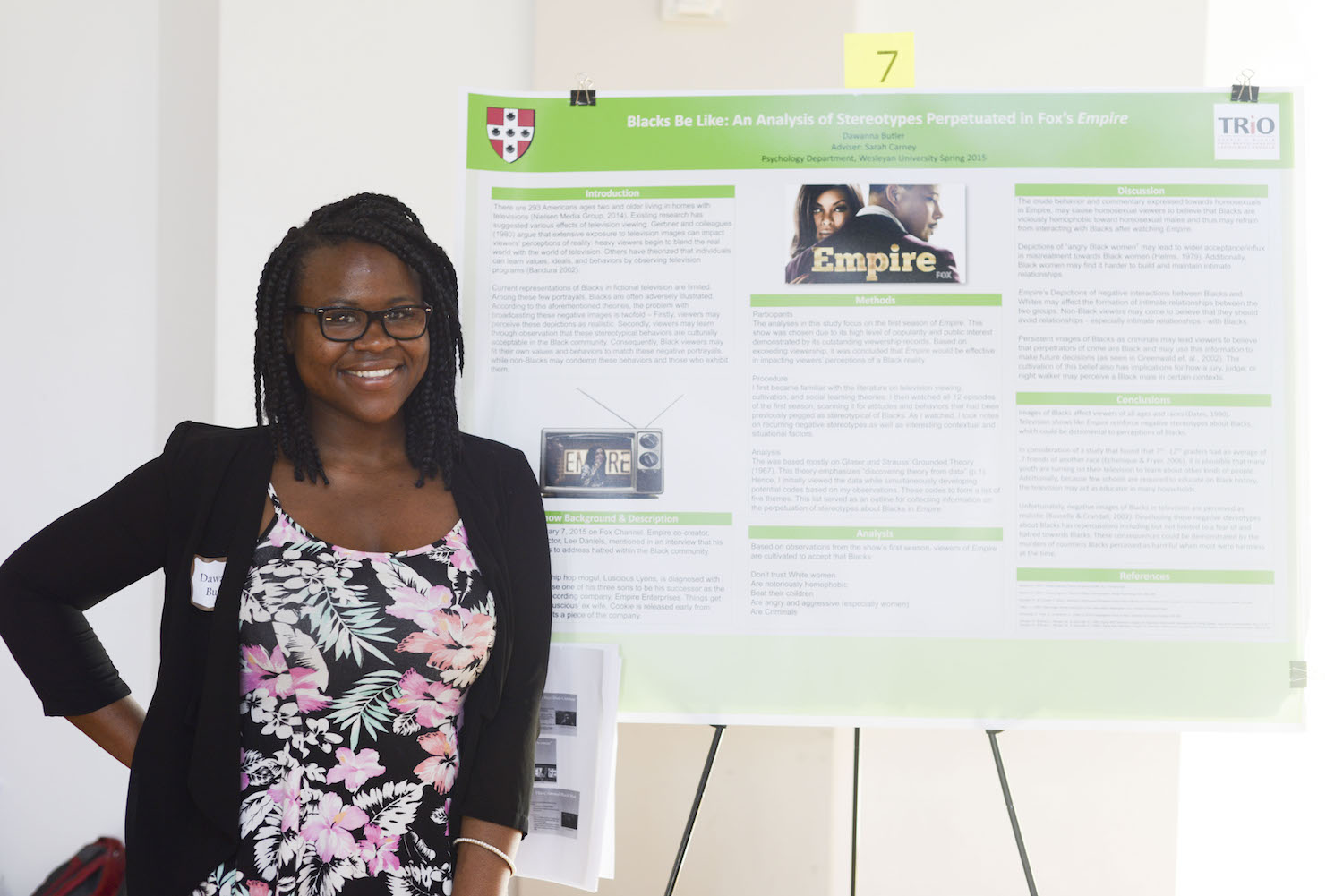 Dawanna Butler '15 with her poster, "Blacks Be Like: An Analysis of Stereotypes Perpetuated in Fox's Empire." 