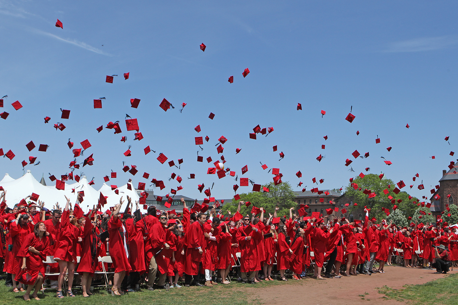 New graduates toss hats following the 183rd Commencement Ceremony May 24. 