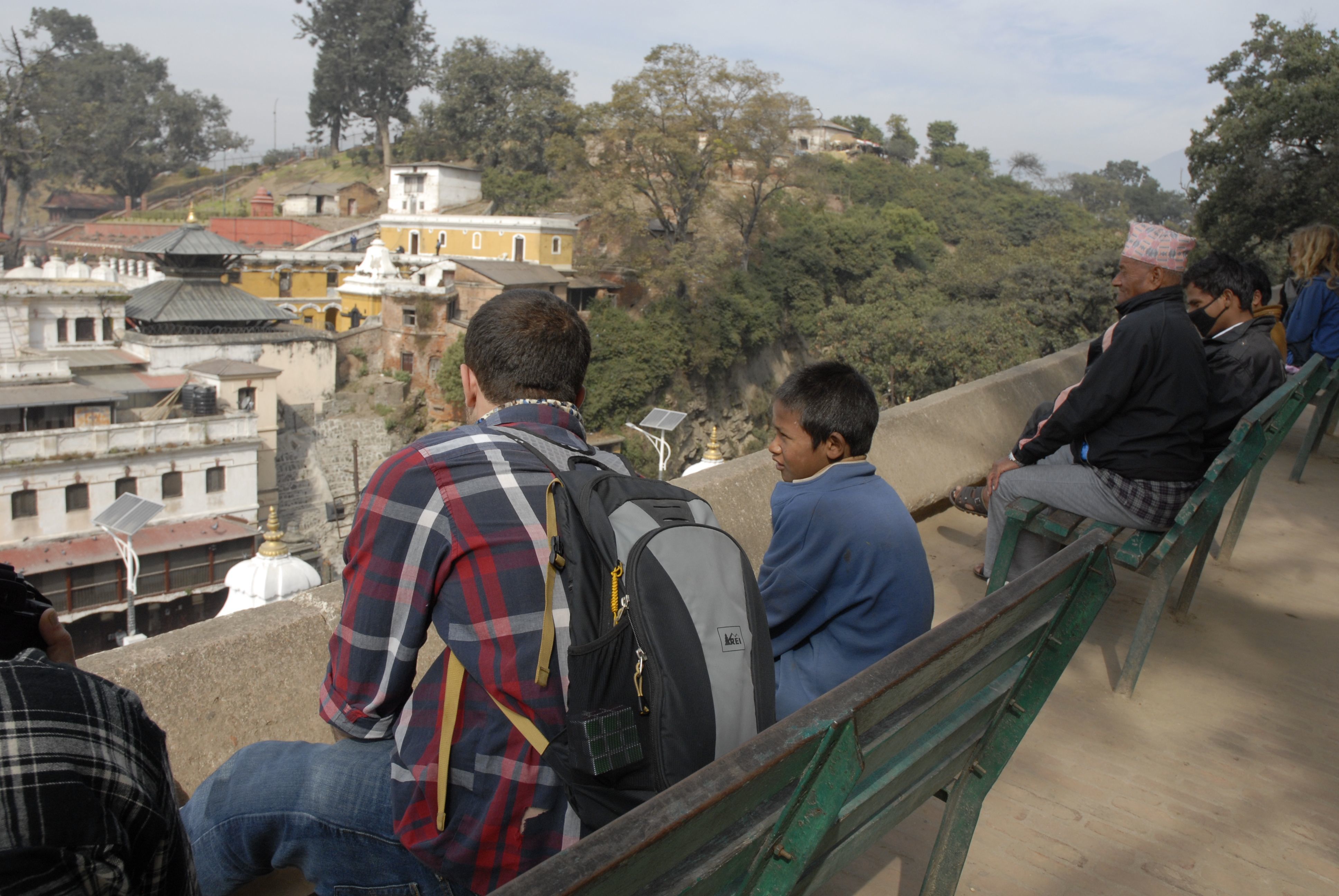 Michael Greenwald '16 speaking with a street boy who had approached him at Pashupatinath Temple.