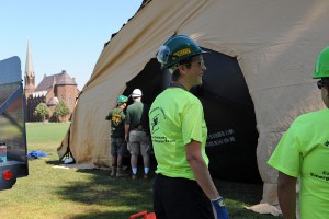 C-CERT member Jen Curran helps construct the medical tent. 
