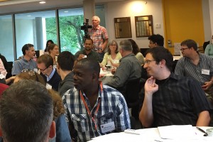 Pictured at far right, wearing a striped shirt, Francis Starr worked with more than 40 other faculty from around New England at the Summer Institute. 