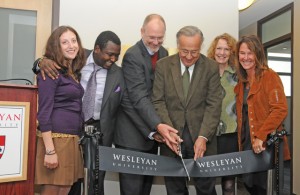 The Patricelli Center, opened in 2011, is working to close a funding gap. At the May 2011 ribbon cutting for the center, from left to right, are Jessica Posner Odede '09, Kennedy Odede '12, Board of Trustees Chair Joshua Boger '73, P '06, P '09, Bob Patricelli '61, P '88, P'90, Margaret Patricelli  P '88, P'90, and Alison Patricelli '90.  (Photo by Olivia Drake.)