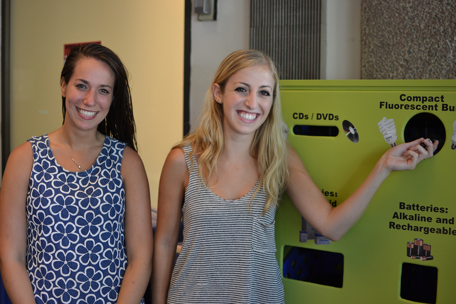 Tess Litchman '16 and Maya Berkman '16 were all smiles as they used the new center to recycle an old fluorescent light bulb.