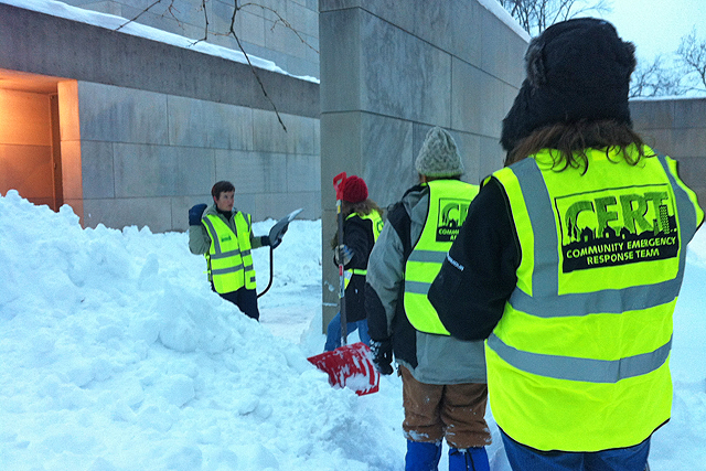 During Winter Storm Nemo in 2013, the C-CERT team worked to inspect and clear all emergency exits near academic and administrative buildings. Pictured at left is Jennifer Curran.