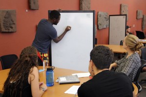 Students interact during their Physics 113, General Physics class. 