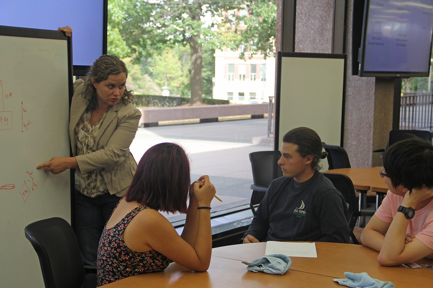 Chris Othon, assistant professor of physics, is teaching a project-based teaching and learning course. (Photo by Rebecca Goldfarb Terry '19)