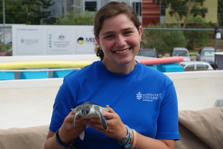 Nash poses with one of her Flatback turtles.