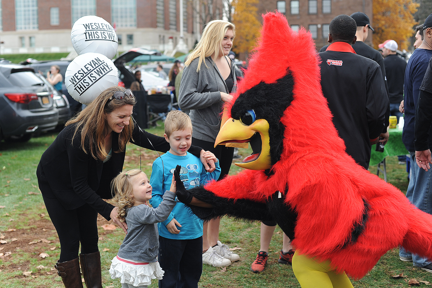 Members of the Wesleyan community, friends and family gathered on Andrus Field on Nov. 7 for tailgaiting before the Homecoming football game against rival Wlliams College. (Photo by Olivia Drake MALS '08)